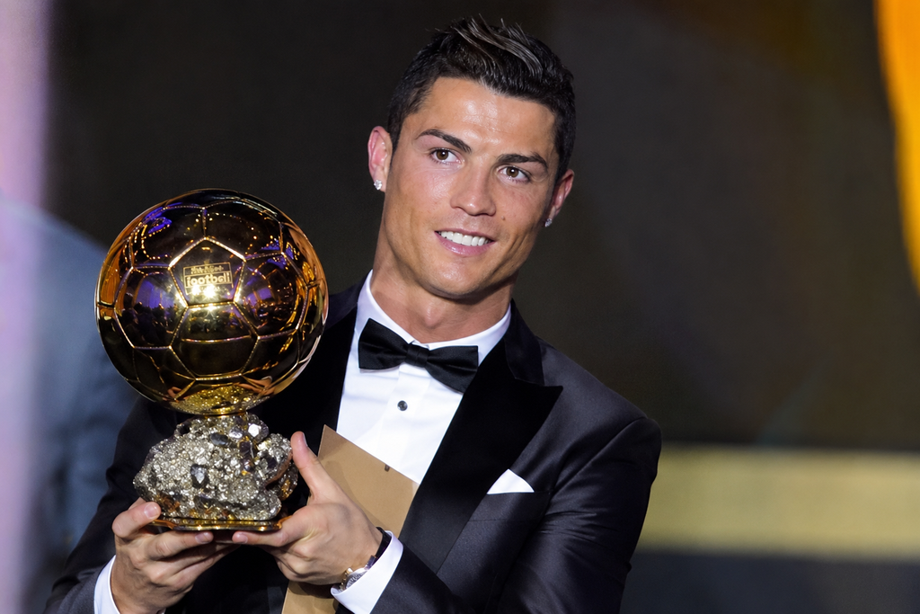 Cristiano Ronaldo celebrates winning his first Ballon d’Or in 2008 after a trophy-winning season with Manchester United.