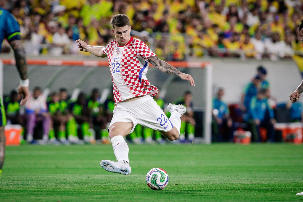 Luka Vuskovic demonstrates his defensive strength during a competitive football match.